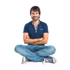 Man with his arms crossed over white background
