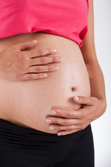 Pregnant woman taking care about her belly