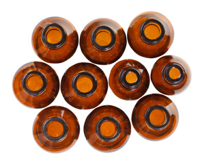top view of many small open brown glass bottles