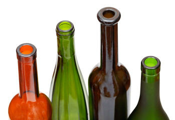 bottlenecks of few colored wine bottles close up