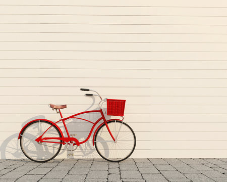 red retro bicycle with basket in front of the white wall