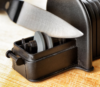 Sharpening Of Knife In A Kitchen