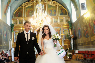 Fototapeta premium bride and groom in the church