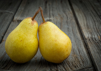 sweet pear closeup on wooden background