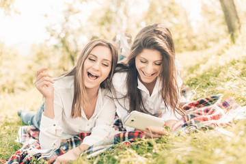 girls watching smart phone