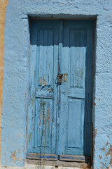 Old door of ruined home in Kefalos
