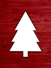 Christbaum auf roten Holzbrettern