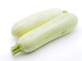 green zucchini on white background