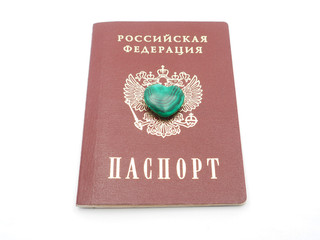 malachite heart and Russian passport on white background