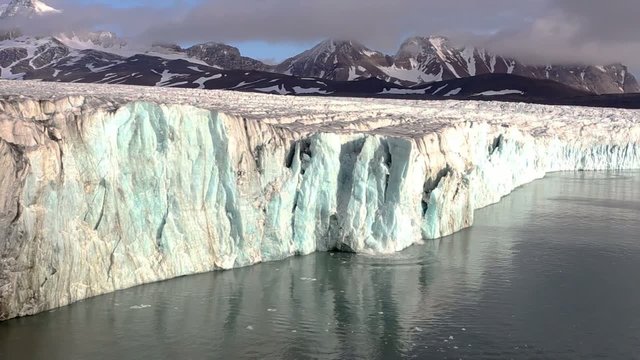 Ice Calving From The Tidewater Glacier In The Arctic