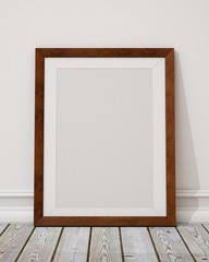 blank wooden picture frame on the wall and the floor