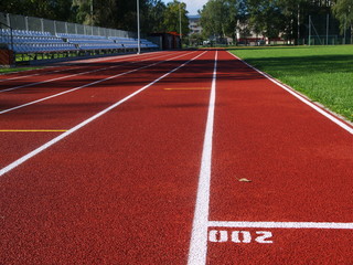 Fototapeta premium Red racetrack on the stadium