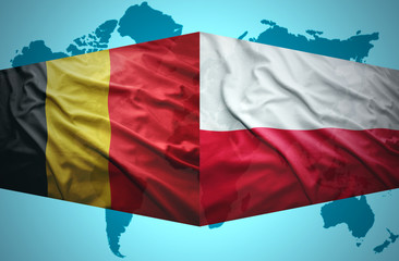 Waving Belgian and Polish flags