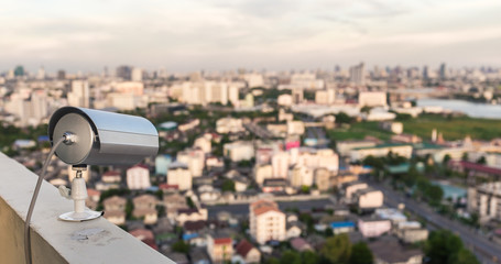 CCTV Camera or surveillance Operating with city view © stnazkul