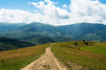 Dirt road against the landscape in the Ukrainian Carpathians