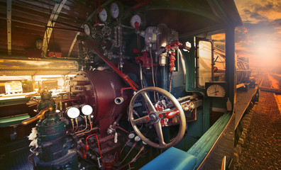 inside control room of stream engine locomotive train parking on