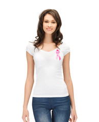 Fototapeta premium smiling woman with pink cancer awareness ribbon