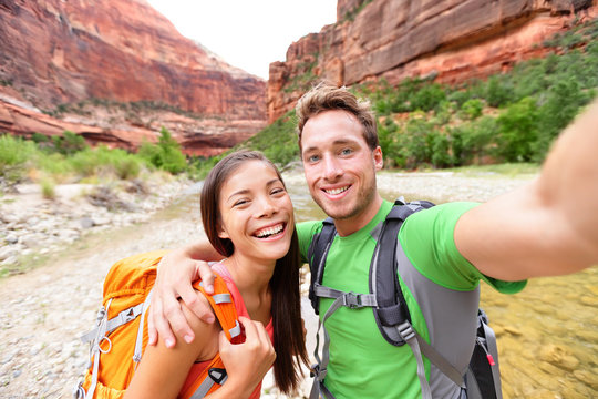 Travel hiking selfie by happy couple on hike
