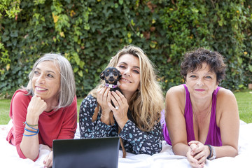 adult women posing in green