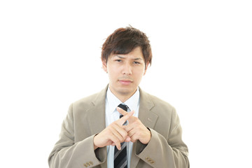 禁止の意思表示をするビジネスマン