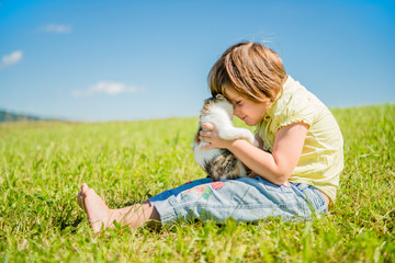 Fototapeta premium Child with kitten