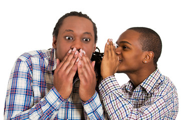 Guy whispering into man's ear, men spread rumor
