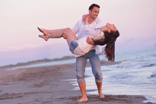 young couple  on beach have fun