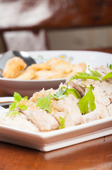 steamed chicken with tofu on a side