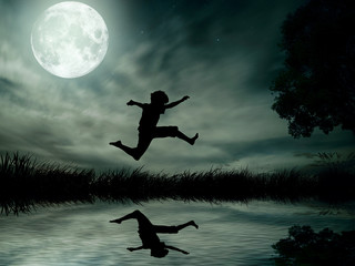 Teenager jumping in water over lake, moonlight moon background