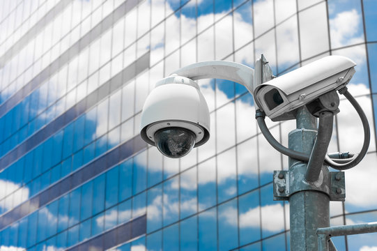 CCTV camera or surveillance operating with galss building in bac
