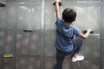 child climbing on a wall