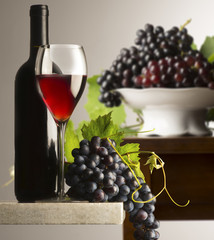 red wineglass with grapes