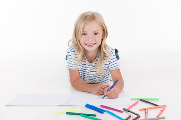 happy pretty girl drawing with pencils.