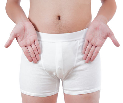 close up of man on white boxer underware pointing at penis isola