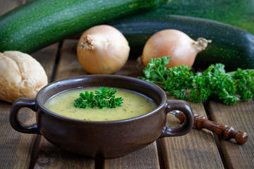 Fresh homemade zucchini soup with onions and parsley