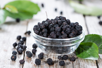 Chokeberries in a small bowl