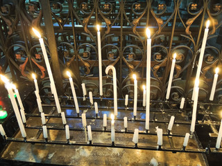 Lighted candles on altar of cathedral