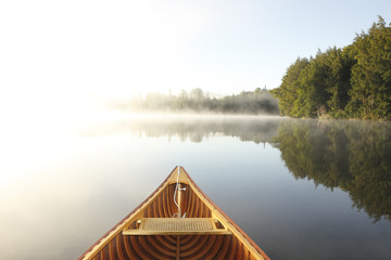 Canoeing on a Misty Lake