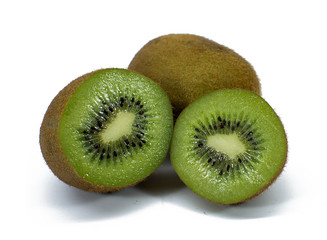 Fototapeta premium Whole kiwi fruit and his sliced segments isolated