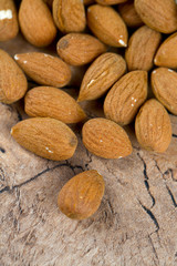 almond nuts on wooden surface