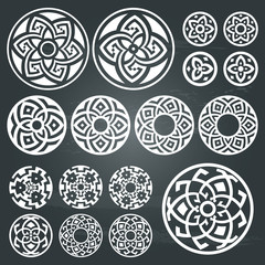 A set of of white round geometric designs