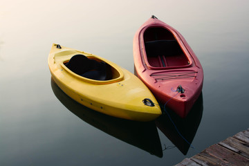Yellow and Red Kayak on the lake