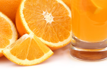 Oranges with glass of juice