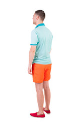 Back view of young manin shorts looking.