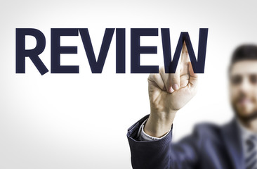 Business man pointing the text: Review