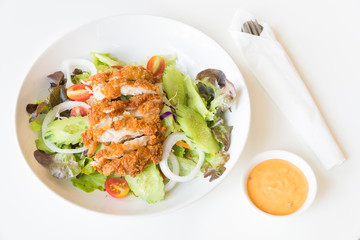 Fried Chicken salad with tomatoes,  Cucumber and Onion.