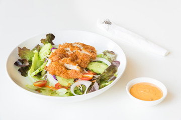 Fried Chicken salad with tomatoes,  Cucumber and Onion.