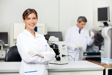 Smiling Female Scientist In Laboratory