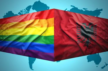 Waving Albanian and Gay flags