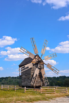 Old wooden windmill on background of blue sky, Kyiv region